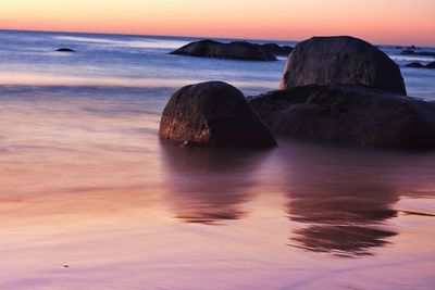 Scenic view of sea at sunset