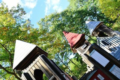 Low angle view of built structure against trees