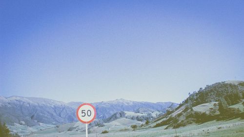 Landscape with mountain range in background