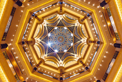 Low angle view of illuminated ceiling