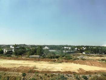 Scenic view of field against clear sky