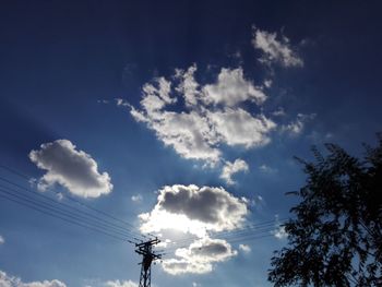 Low angle view of vapor trail against blue sky