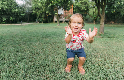 Portrait of happy boy in field