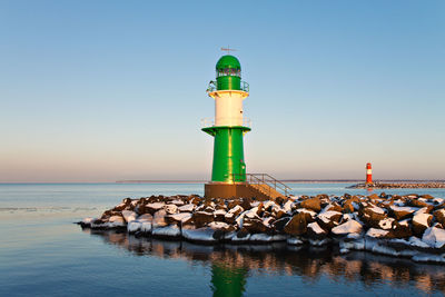 Lighthouse at calm blue sea