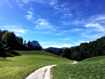 Empty road along countryside landscape