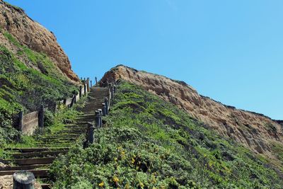 Low angle view of steps leading towards mountain