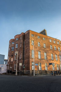 Low angle view of building against blue sky