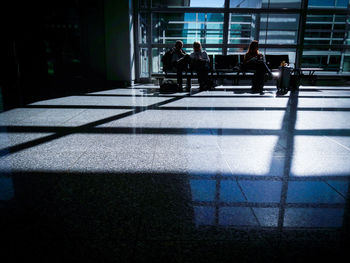 People sitting in front of window