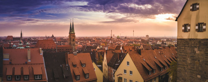 High angle view of buildings against sky during sunset