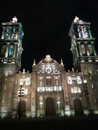 Low angle view of illuminated building at night