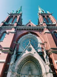 Low angle view of cathedral and buildings against sky