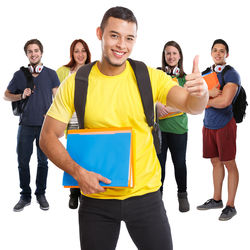 Portrait of friends standing against white background