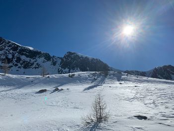 Scenic view of snowcapped mountains against sky