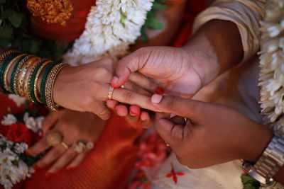 Midsection of woman holding hands