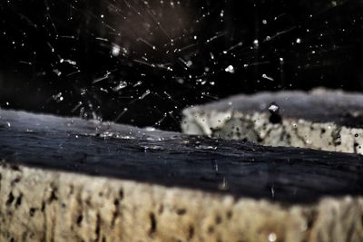 Close-up of water splashing on wood