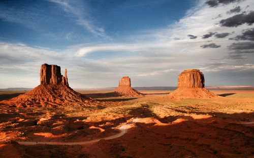 View of desert against cloudy sky