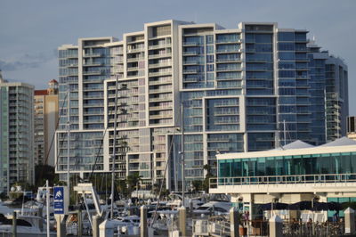 Modern buildings in city against sky