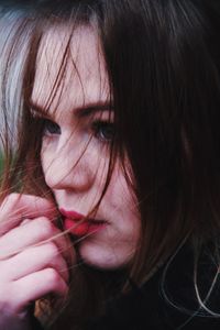 Close-up portrait of a beautiful woman with eyes closed