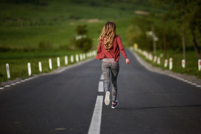 Woman running on road