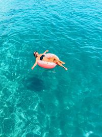 High angle view of woman swimming in sea