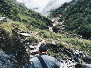 Rear view of a man on countryside landscape