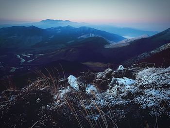 Scenic view of mountains against sky during winter