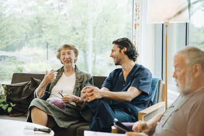 Group of people sitting at home