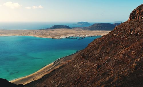 Coastal scenery, view from mirador de nahum on playa del risco and island la graciosa at lanzerote