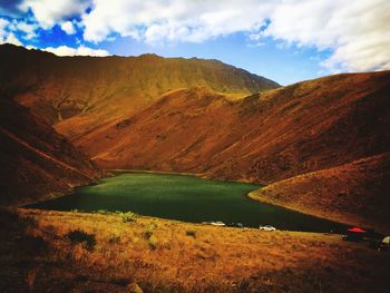 Scenic view of mountains against cloudy sky