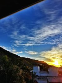 Built structure against cloudy sky at sunset