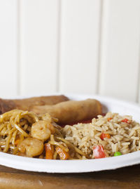 Close-up of pasta served in plate on table