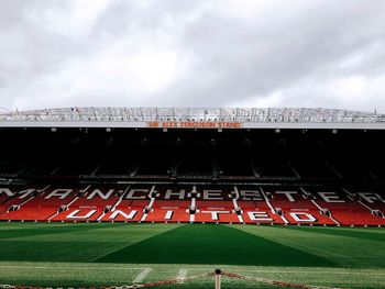 View of soccer field against cloudy sky