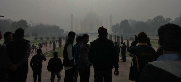 Silhouette of people in foggy weather