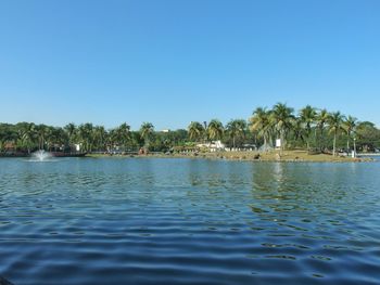 Scenic view of lake against clear blue sky