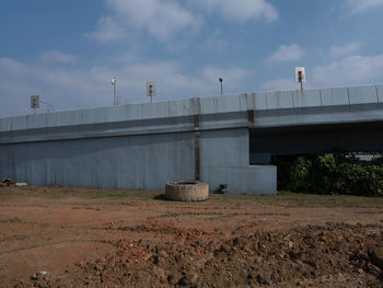 Bridge on field against sky