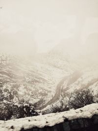 Scenic view of snow covered mountains against sky