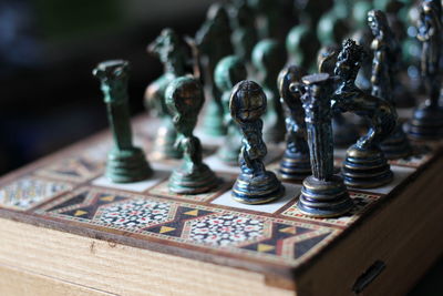 Close-up of chess pieces on table