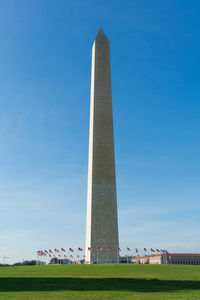 Low angle view of washington monument against blue sky