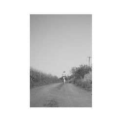 Woman walking on road