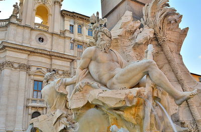 Low angle view of statue of historic building