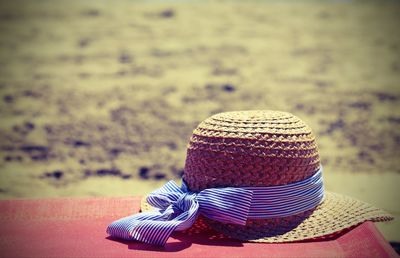 Close-up of hat on table at beach
