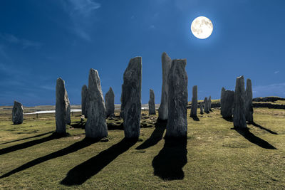 Scenic view of moon against blue sky