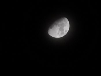 Low angle view of moon against sky at night