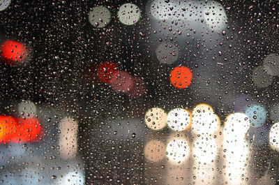 Full frame shot of wet glass window in rainy season