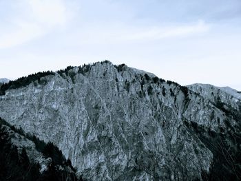 Low angle view of rock formations against sky