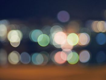 Defocused image of illuminated lights at night