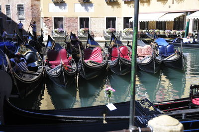 Gondola boats moored in canal