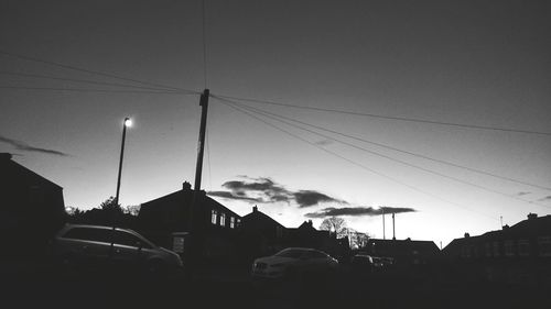 Cars on road at sunset