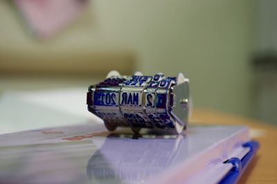 Close-up of rubber stamp on table