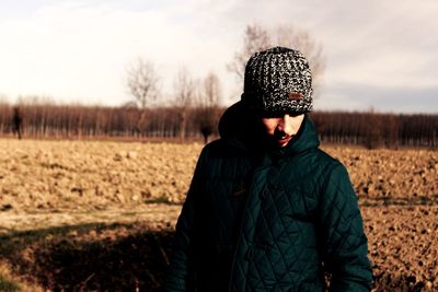 Man standing on field during winter